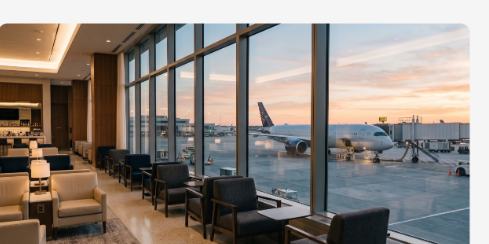An airport lounge overlooking a plane at sunset